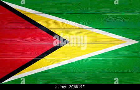 Guyana Flagge auf alten Holzbrett Hintergrund gemalt. Gebürstetes Holzbrett Textur. Holzstruktur Hintergrund Flagge von Guyana. Stockfoto