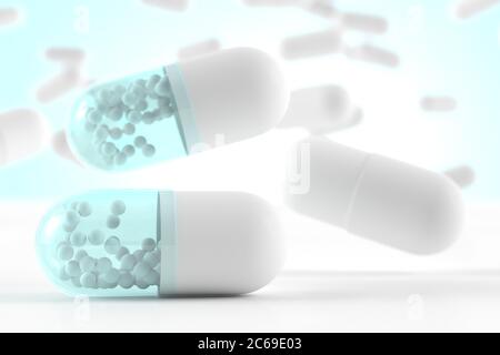 Fallende weiße blaue Kapseln mit einem Medikament mit schön verschwommenem Hintergrund; 3d-Illustration Konzept Stockfoto