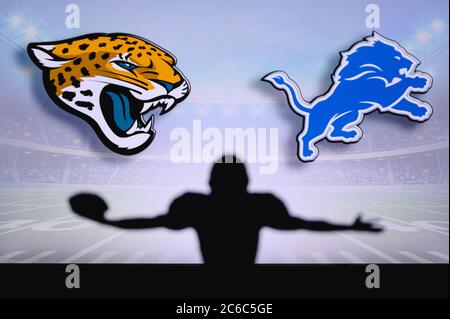 Jacksonville Jaguars vs. Detroit Lions. NFL-Spiel. American Football League Spiel. Silhouette des professionellen Spieler feiern Touch Down. Bildschirm in BA Stockfoto