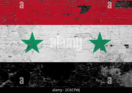 Syrien Flagge auf grunge zerkratzte Betonoberfläche. Nationaler Vintage Hintergrund. Retro-Wandkonzept. Stockfoto