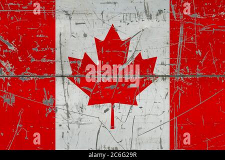 Kanada Flagge auf rissige schmutzige Oberfläche gemalt. Nationales Muster auf Vintage-Style-Oberfläche. Verkratzt und verwittert Konzept. Stockfoto