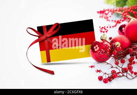 Deutschland Flagge auf Neujahr Einladungskarte mit roten weihnachtsschmuck Konzept. National Happy New Year Komposition. Stockfoto