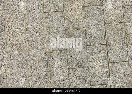 Abstrakter Hintergrund - graue Pflasterplatten. Platten mit Texturen. Foto in hoher Auflösung. Stockfoto