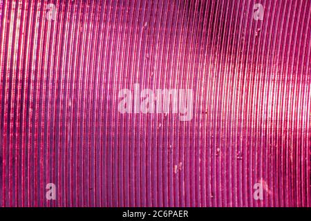 Textur von glänzend rosa Kunststoff Nahaufnahme Stockfoto