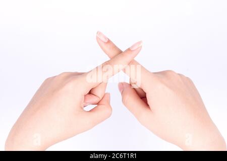 Finger Hand Symbole isoliert Konzept Kreuz und Lüge konzeptionell auf weißem Hintergrund Stockfoto