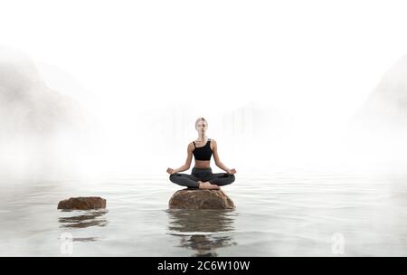 Frau praktiziert Yoga und meditiert auf dem See. Stockfoto