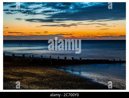 Cromer Strand an einem Sommeruntergang Abend Stockfoto