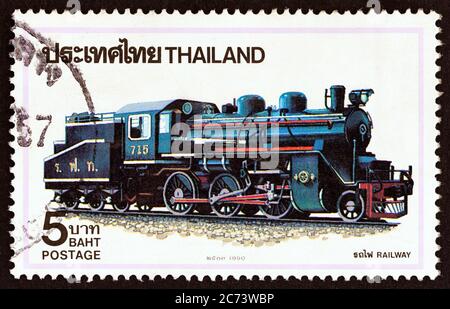 THAILAND - UM 1990: Eine in Thailand gedruckte Marke aus der 'Steamlokomotiven'-Ausgabe zeigt die Lokomotive der Baureihe C 56 Nr. 715, Japan, um 1990. Stockfoto