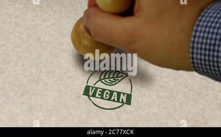 Vegane Stempel und Stempelhand. Lebensstil, Ökologie, Bio, Bio-Lebensmittel, vegetarische und natürliche gesunde Ernährung Konzept. Stockfoto