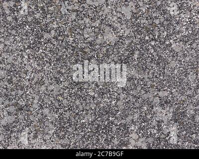 Grungy Pflaster Oberfläche Hintergrund. Alte Stein Wand Textur. Grau verwittert Asphalt Straßenoberfläche. Stockfoto