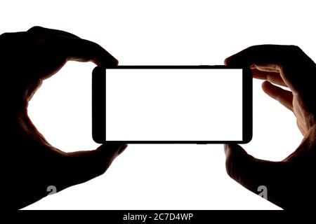 Silhouette der Hände mit Smartphone Aufnahme Bild isoliert auf weißem Hintergrund. Bildschirm mit Kopierbereich. Leer oder Modell für Design. Stockfoto