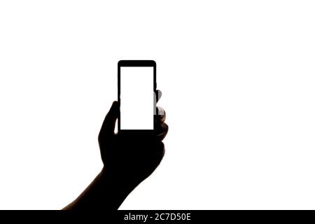 Silhouette der Hand mit Smartphone Aufnahme Bild isoliert auf weißem Hintergrund. Bildschirm mit Kopierbereich. Leer oder Modell für Design. Stockfoto