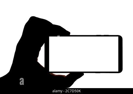 Silhouette der Hand mit Smartphone Aufnahme Bild isoliert auf weißem Hintergrund. Bildschirm mit Kopierbereich. Leer oder Modell für Design. Stockfoto
