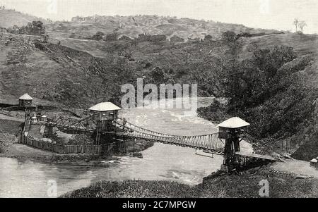 Die spanische Armee auf den Philippinen 1896-1898. Hängebrücke über den Agus. Philippine Island. Von La Ilustracion Española y Americana 1895 Stockfoto