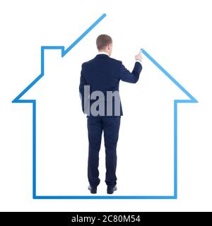 Architektur oder Immobilien-Konzept - Rückansicht des jungen Geschäftsmanns Zeichnung Haus isoliert auf weißem Hintergrund Stockfoto