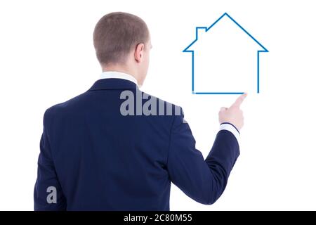 Immobilien-Konzept - Rückansicht des jungen Geschäftsmanns Zeichnung Haus isoliert auf weißem Hintergrund Stockfoto