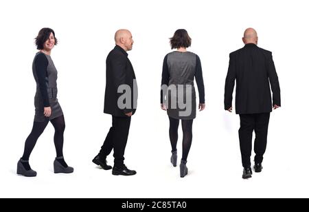 Rückansicht und Seitenansicht eines eleganten Paares, das auf weißem Hintergrund läuft Stockfoto