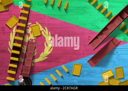 Eritrea Flagge mit nationalem Hintergrund mit Dominosteine auf Holztisch. Draufsicht. Spielkonzept. Stockfoto