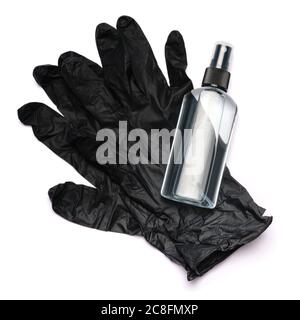 Draufsicht der Flasche mit Desinfektionsmittel über dem Schutzhandschuh aus Gummi-Latex Stockfoto