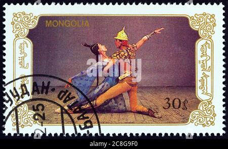 MONGOLEI - UM 1989: Eine in der Mongolei gedruckte Briefmarke aus der 'Ballett'-Ausgabe zeigt Tänzer, um 1989. Stockfoto