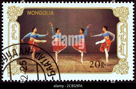 MONGOLEI - UM 1989: Eine in der Mongolei gedruckte Briefmarke aus der 'Ballett'-Ausgabe zeigt Tänzer, um 1989. Stockfoto