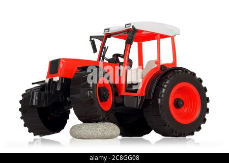 Kunststoff Spielzeug Traktor isoliert auf weißem Hintergrund Stockfoto