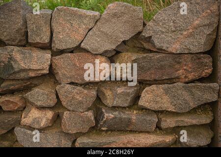 Hintergrund, Textur, Wand aus Stein Granit Blöcke. Hochwertige Fotos Stockfoto