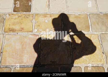 Der Schatten des Menschen, der Fotos gemacht hat Stockfoto