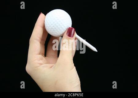 Bild von Golfball auf schwarzem Hintergrund. Stockfoto
