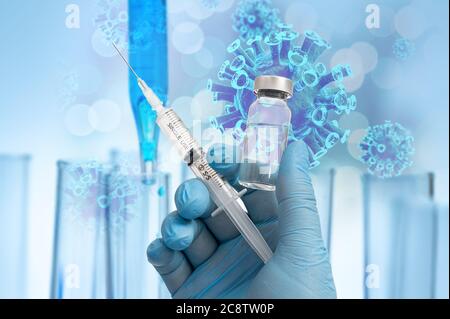 Die Hand des Wissenschaftlers hält den Covid-19-Impfstoff mit blauen Handschuhen im Hintergrund des Biotechnologie-Konzepts. Stockfoto