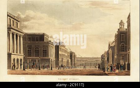 Blick Richtung Süden auf die Regent Street zum Prince Regent’s Palace Carlton House, London. Links, am Eingang zur Charles Street (heute Charles II Street), befindet sich das United Service Club-House. Rechts sind der Portikus und der Turm der Waterloo Chapel, entworfen von John Adey Repton, Warren’s Hotel, etc. Die Straße ist mit gasbeleuchteten Lampenpfosten gesäumt. Handkolorierter Kupferstich aus Rudolph Ackermanns Repository of Arts, Literature, Moden, Manufactures, etc., Strand, London, 1822. Stockfoto