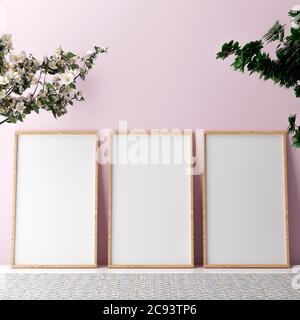 Blank vertikalen Posterrahmen Mock up stehen auf beigefarbenem Boden. Drei Holzrahmen isoliert im skandinavischen Interieur. 3d-Rendering Stockfoto