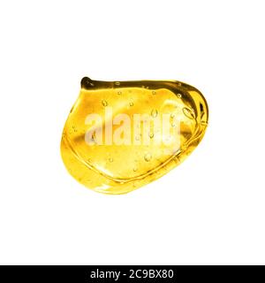 Transparentes Goldgel mit Blasen in schöner Vitamin C Serum Gel Textur Stockfoto