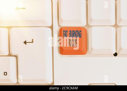Textzeichen mit Fat Burning Foods. Business Foto präsentiert produzieren Fettabbau durch die Stimulierung des Stoffwechsels, um den Appetit zu reduzieren verschiedene farbige keyboar Stockfoto
