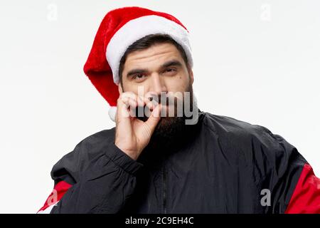 Frech Santa raucht eine Zigarette Neujahr Bad Santa Stockfoto