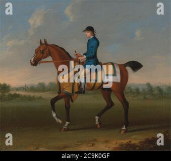 James Seymour - EIN Bay Racehorse mit Jockey Up Stockfoto