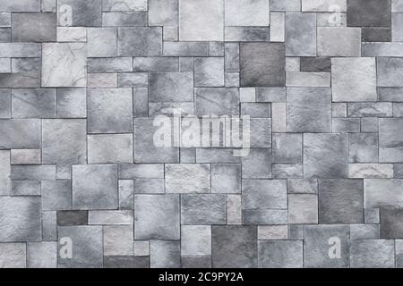 Quadrate Hintergrund, Stein Wand Textur, grauen Steinboden. Monochromer Granit, Ziegeloberfläche. Architektonisches Design-Konzept Stockfoto