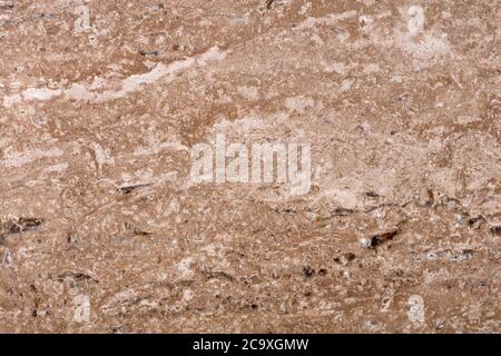 Natürlicher Travertin Hintergrund in brauner Farbe für Ihr neues stilvolles Interieur. Hochwertige Textur. Stockfoto