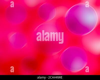 Abstrakter Hintergrund in rot und rosa mit verschwommenen Blasen Stockfoto