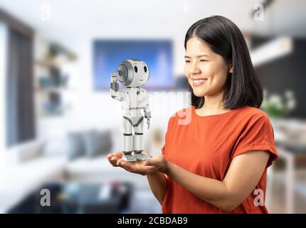 Roboter-Assistent Konzept mit asiatischen Frau halten 3d-Rendering-Roboter Stockfoto