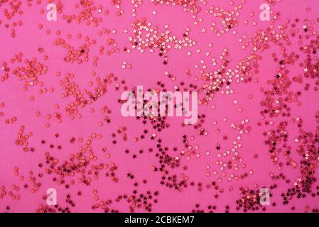 Rosa Hintergrund mit vielen kleinen Sternen glitzern Stockfoto