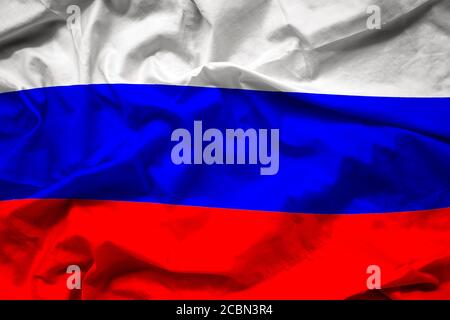 Winkende bunte Nationalflagge Russlands, russische Föderation auf Seidenstruktur Stockfoto