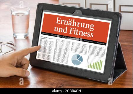 Ein Tablet-Computer auf einem Schreibtisch - Ernährung und Fitness - Ernahrung und Fitness Deutsch Stockfoto