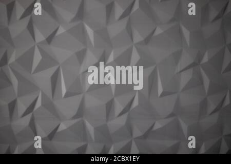 Abstrakter Hintergrund von Polygonen auf grauem Hintergrund. Stockfoto