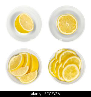 Zitronen in weißen Glasschalen. Frisch geschnittene Zitronenhälften, Keile und Scheiben. Reife und gelbe Zitrusfrüchte, für kulinarische Zwecke verwendet. Citrus limon. Stockfoto