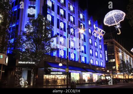 London, Großbritannien - 10. November 2011: Die Weihnachtsbeleuchtung Dekorationen außerhalb des Hauses Fraser bei Nacht in der Oxford Street während der festlichen Jahreszeit, die ist Stockfoto