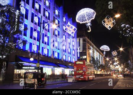 London, Großbritannien - 10. November 2011: Die Weihnachtsbeleuchtung Dekorationen außerhalb des Hauses Fraser bei Nacht in der Oxford Street während der festlichen Jahreszeit, die ist Stockfoto