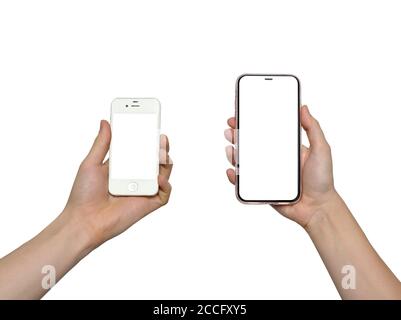 Telefon. Frau und Mann Hände hält die Smartphones weißen Hintergrund. Veraltetes Modell und moderne rahmenlose Design-Smartphones Stockfoto