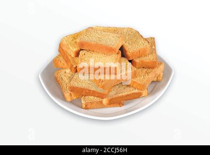 Knuspriger Rusk oder Toast für ein gesundes Leben, traditionelle Keksschale mit Tee, Toast zum Frühstück und Tasse frische Milch & Tee, trockenes Toastbrot, Stockfoto