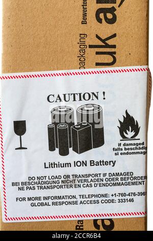 Achtung Lithium-IONEN-Batterie nicht laden oder transportieren, wenn Beschädigter Aufkleber auf dem Paket von Amazon Stockfoto